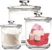 Three clear glass jars with lids filled with various items.