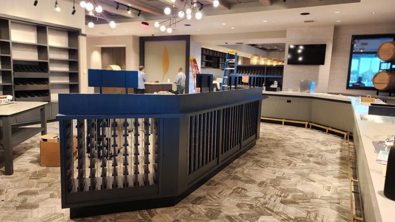 There is a long counter in the middle of the room.