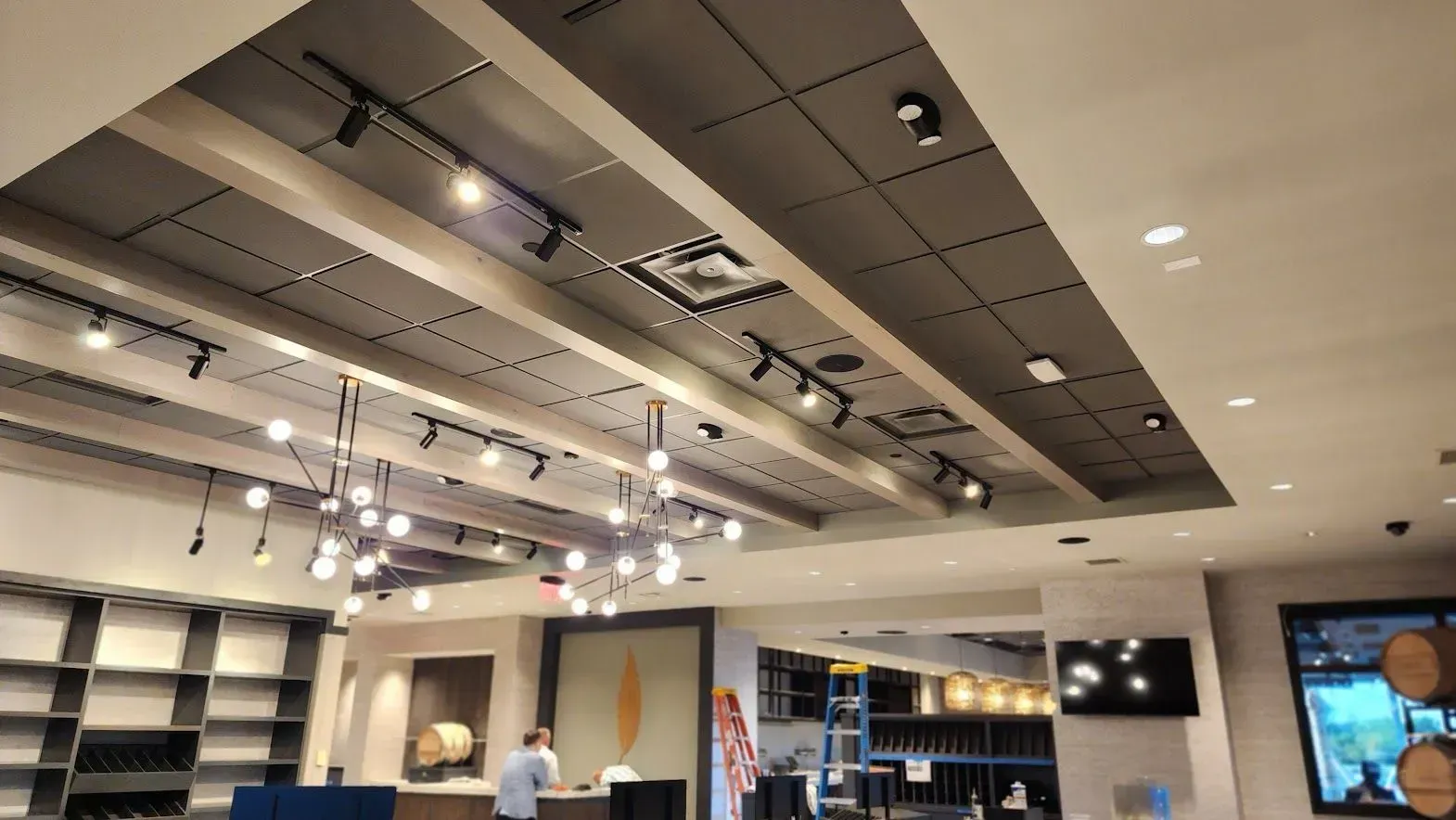 A large room with a ceiling that has a lot of lights on it.