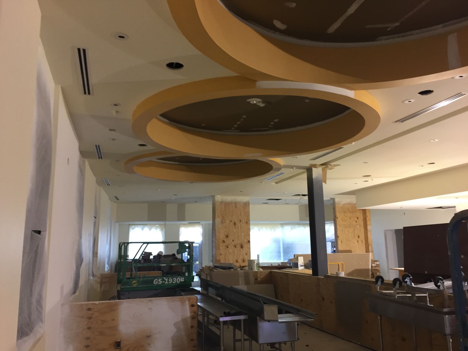 A large room with a lot of circles on the ceiling