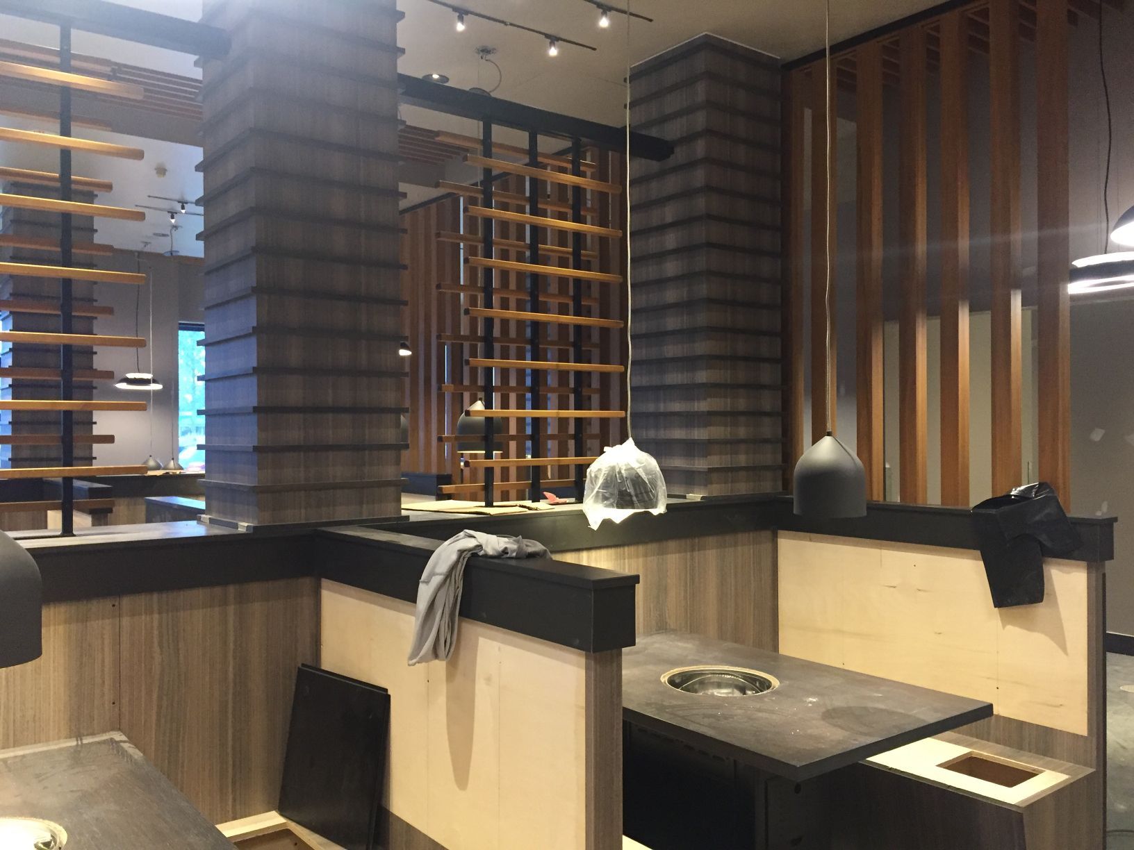 A restaurant with a lot of tables and chairs in it.