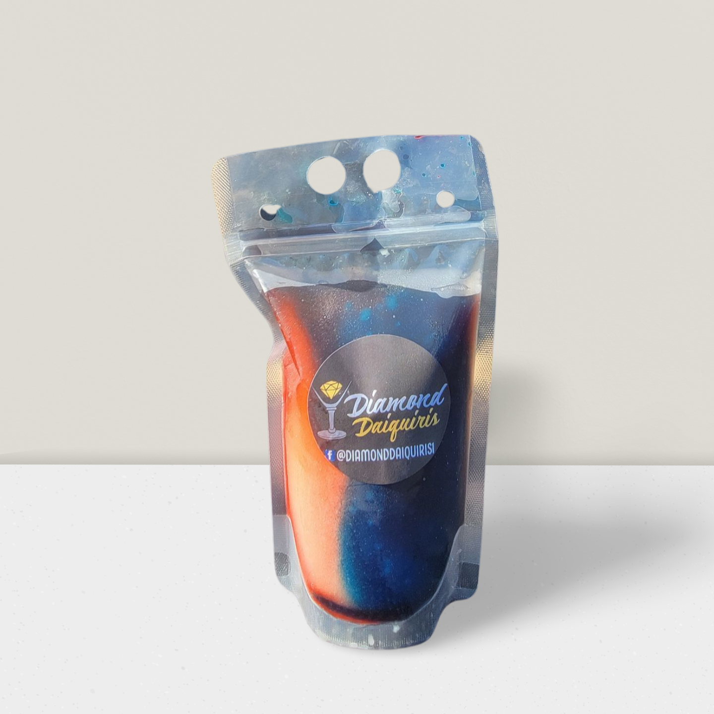 A bag of drinks is sitting on a table.