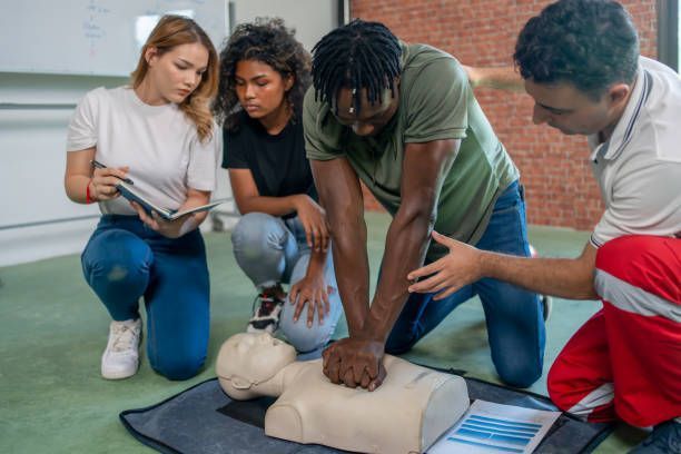 A person is giving a heart massage to a mannequin.