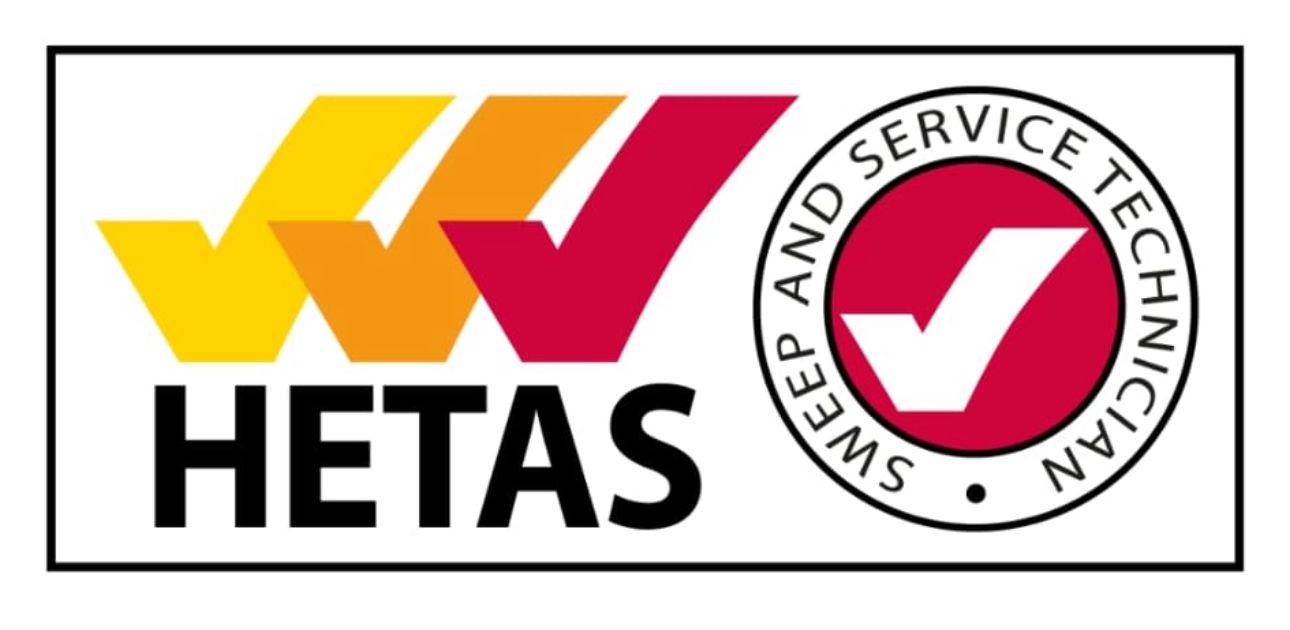 HETAS logo: Three checkmarks in yellow, orange, and red, next to a circular logo with a checkmark