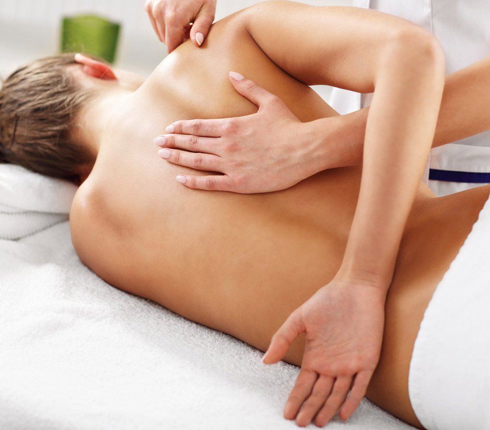 Woman Having Back Therapy — Massage in Port Stephens, NSW