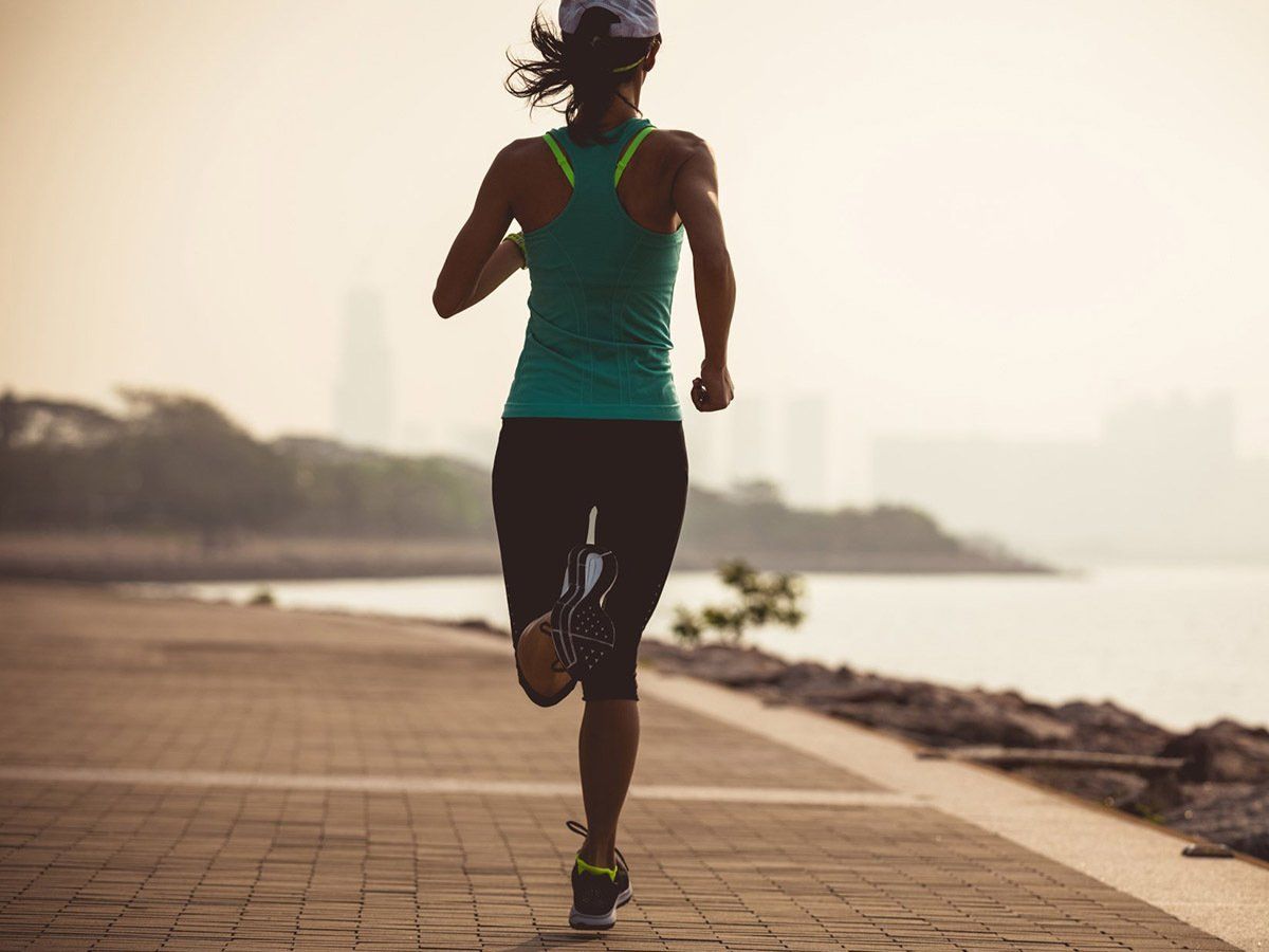 Woman Runner Running — Sports Injury Clinic in Port Stephens, NSW