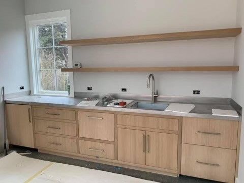 A Kitchen With Wooden Cabinets — Cape Coral, FL — X45 Cabinets