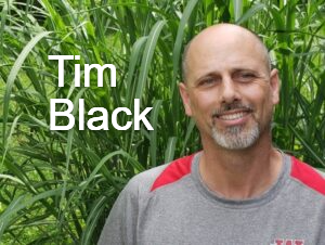 Tim Black, Janitor, standing in front of Hanfield GMC.