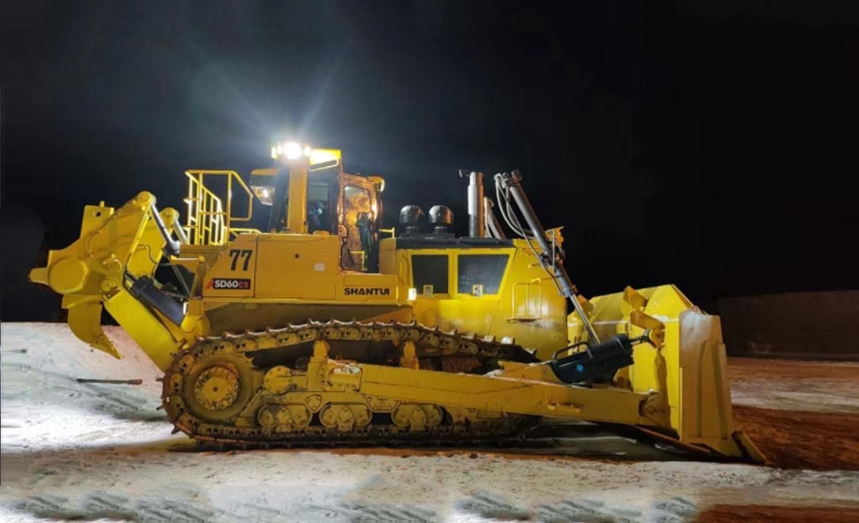 Yellow bulldozer with blade and ripper working at night.— Northern Heavy Machinery in Mount Louisa, QLD