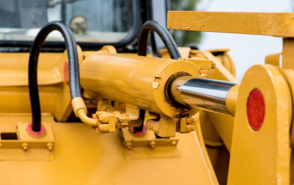 Yellow Hydraulic Cylinder on Heavy Machinery — Northern Heavy Machinery in Cape York, QLD