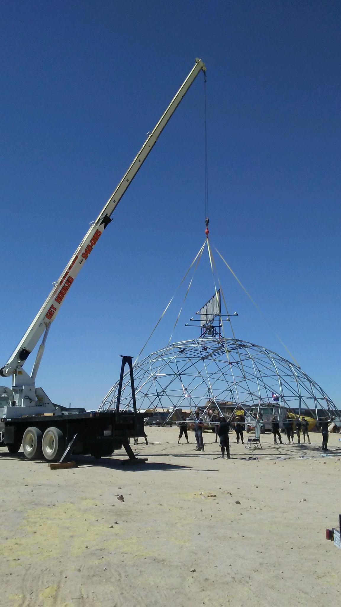 Crane Carrying a Big Metal Piece — Lancaster, CA — Get Hooked Crane Service
