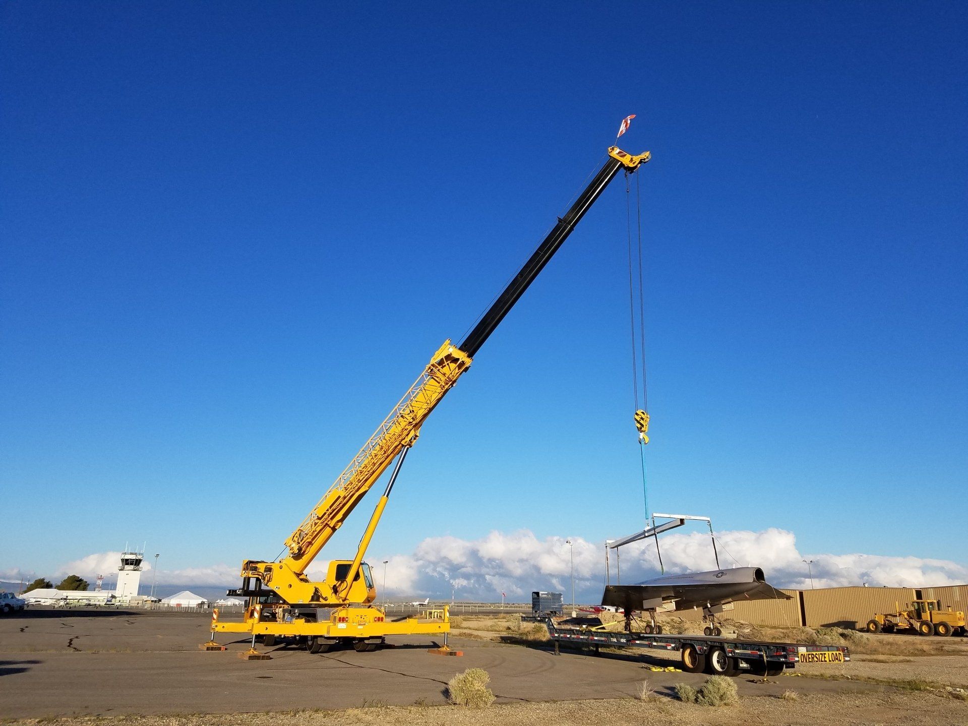 Big Crane Lifting a Jet Plane — Lancaster, CA — Get Hooked Crane Service