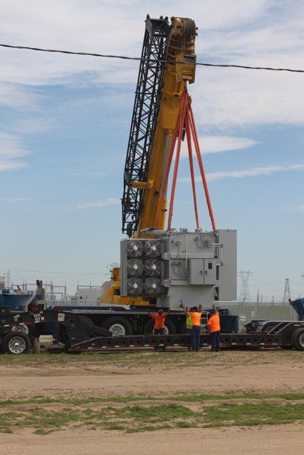 Crane Lifting a Machine — Lancaster, CA — Get Hooked Crane Service