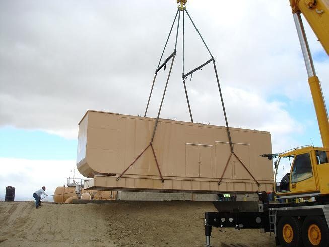 Crane Truck Lifting a Big Container — Lancaster, CA — Get Hooked Crane Service