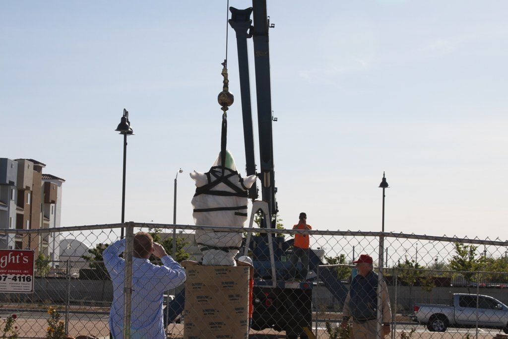 Crane Lifting a Statue — Lancaster, CA — Get Hooked Crane Service