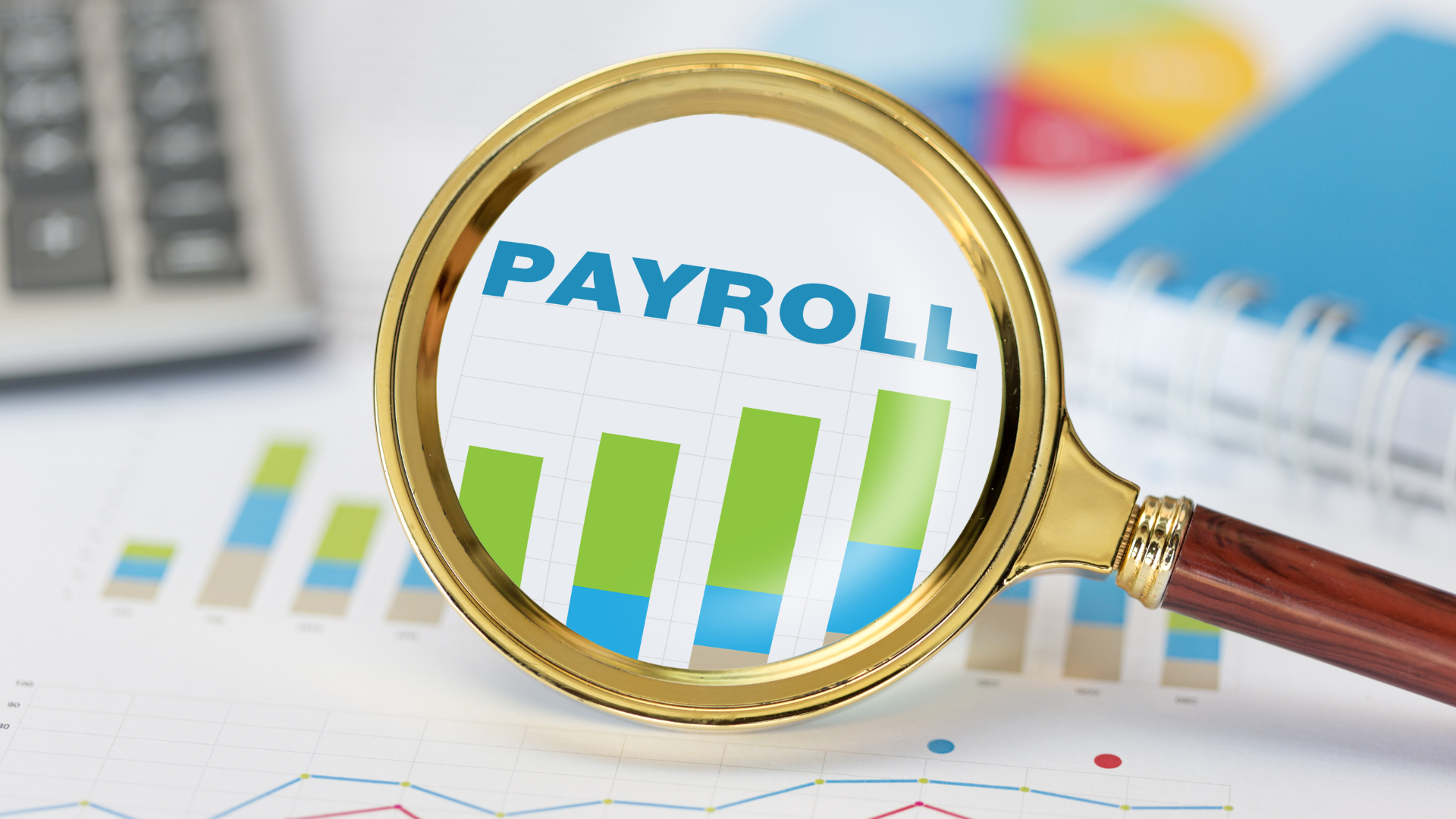 A magnifying glass with the word payroll on it.