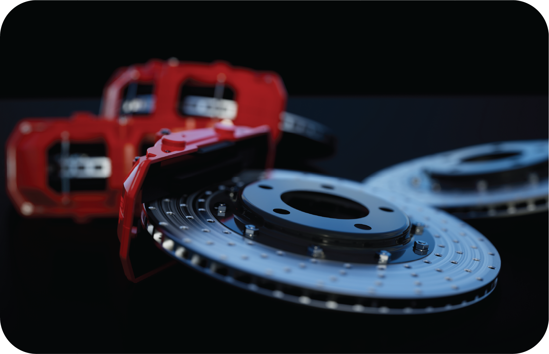 A close up of a brake disc with a red brake caliper in the background