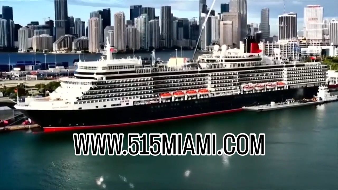 Cruise ship docked in Miami with city skyline visible.