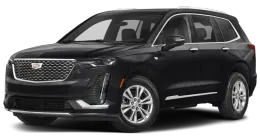 A black cadillac xt6 is shown on a white background.