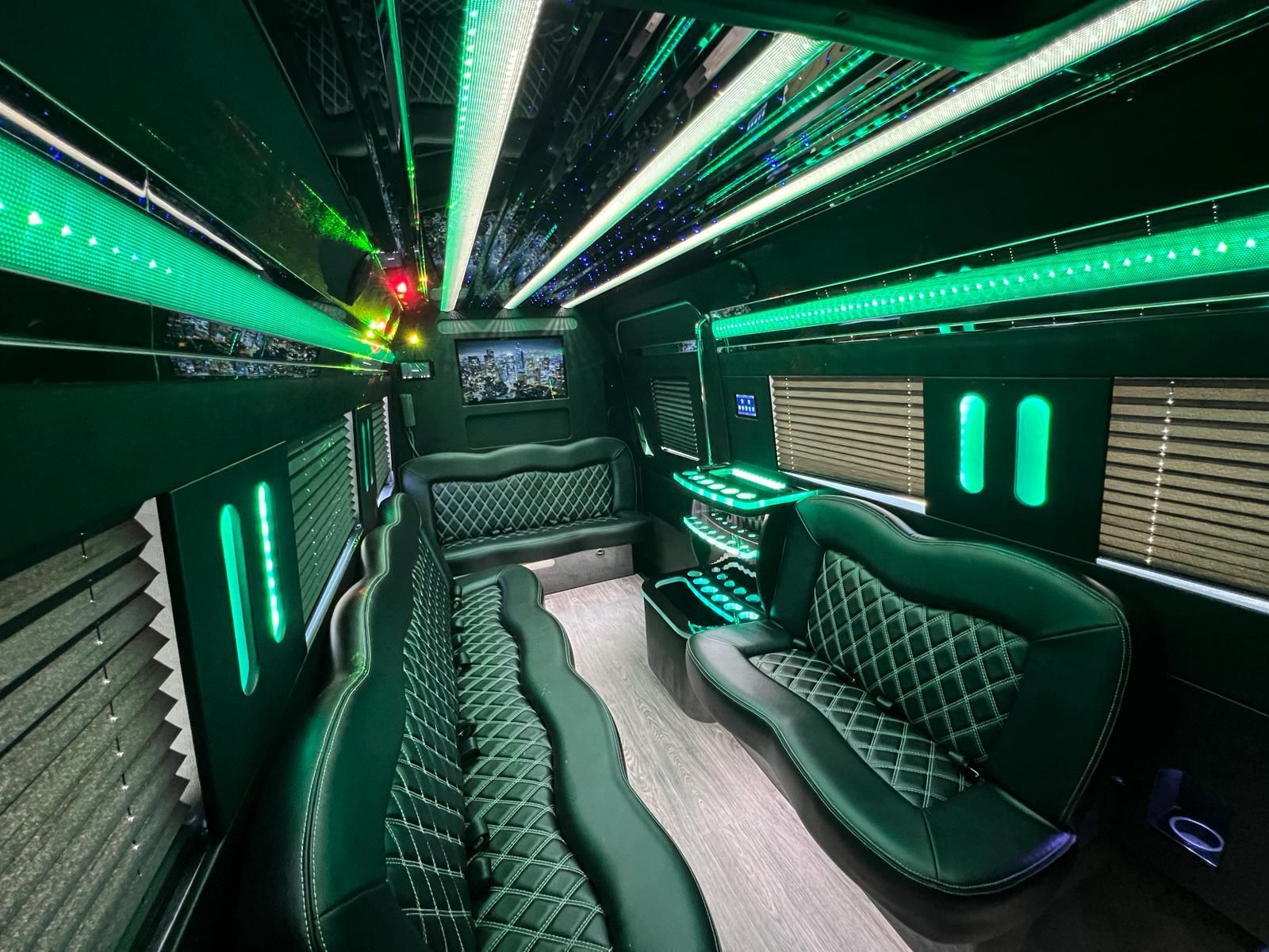 Green-lit luxury interior of a limousine