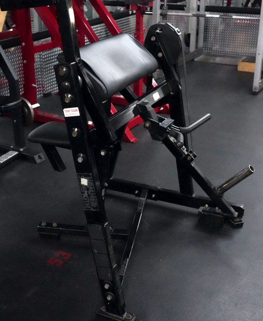 A gym with a lot of red and black equipment