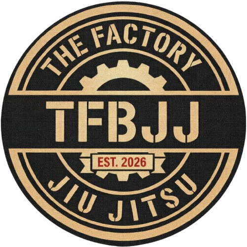 Logo for The Factory Jiu Jitsu: circular, black and tan with text and a gear symbol. "TFBJJ" is prominently displayed.