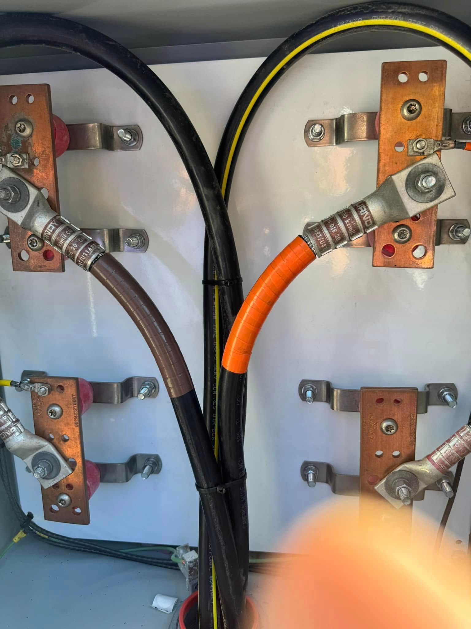A bunch of wires are connected to each other in a box.