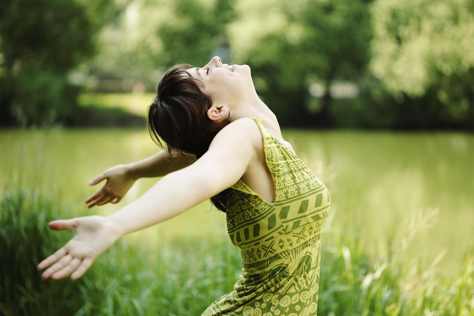 Happy Woman in a Green Field