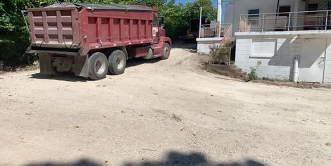 Red Truck Use For Hauling Dirt and Rocks — Eldon, MO — Bates Asphalt Construction