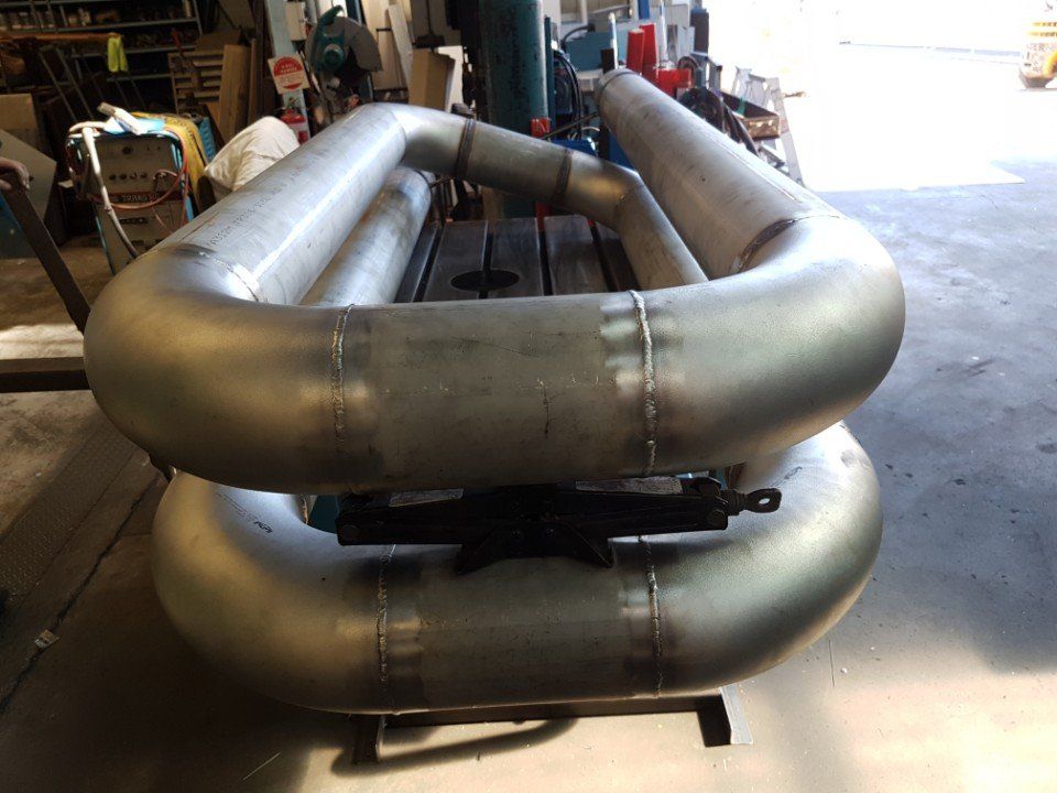 metal pipes being welded