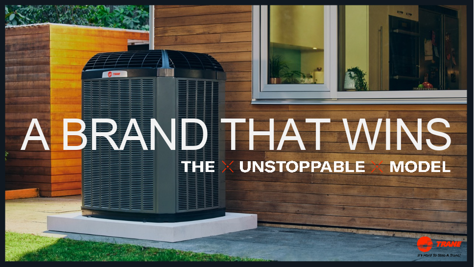 Three gray outdoor HVAC units beside a beige house with windows and landscaping