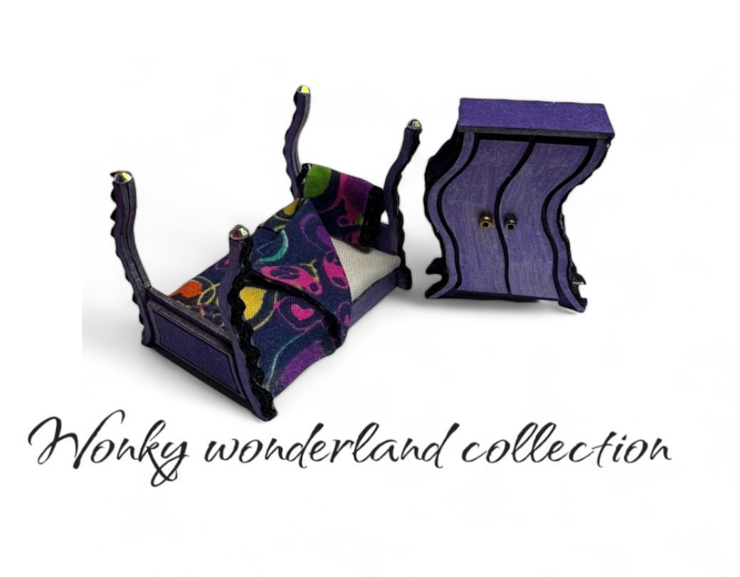 Miniature wonky purple bed and wardrobe, part of the 