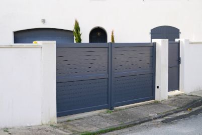 Dark gray coloured matching gates installed in a white painted residential house in Ballarat VIC.