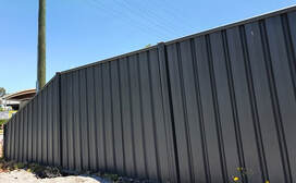 Dark grey colorbond fence panels installed for residential home in Ballarat, VIC.