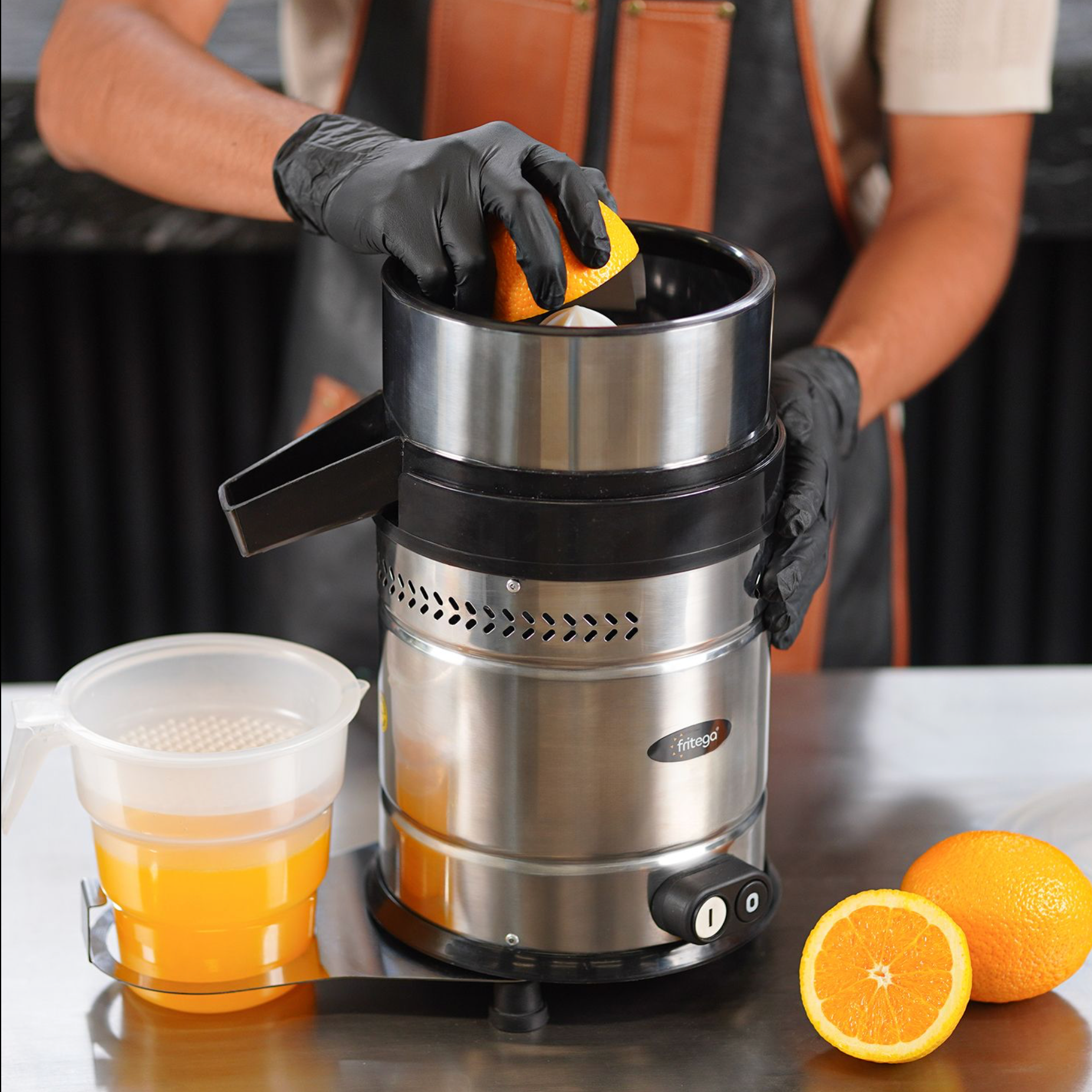 A person is using a blender to make a smoothie