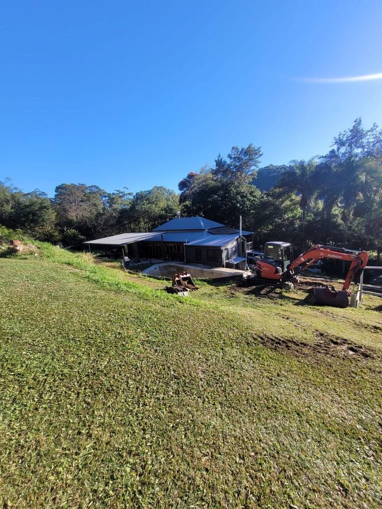 A House is Being Built in the Middle of a Grassy Field — Al's Excavation in Bridges, QLD
