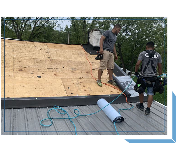 Two Workers Installing Roofing Materials