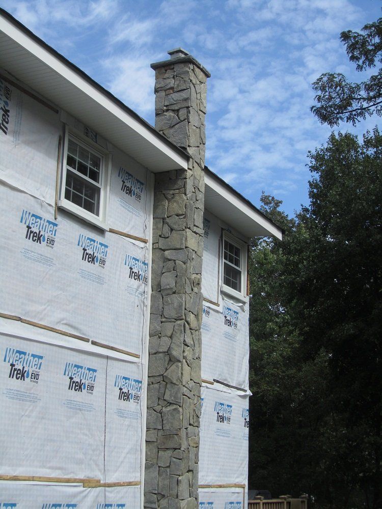 grey stone chimney - residential masonry  in Middletown, NJ