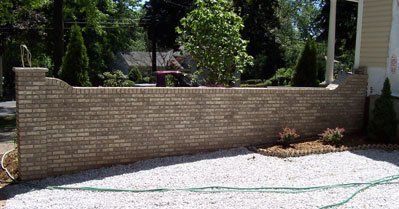 Beige Brick Retaining Wall - Masonry in Middletown, NJ