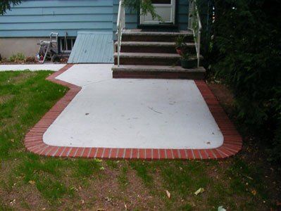 cement patio with brick trim - custom patios in Middletown, NJ