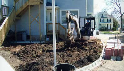 paver patio installation - residential mason clearing land to begin patio remodel - residential masonry in Middletown, NJ
