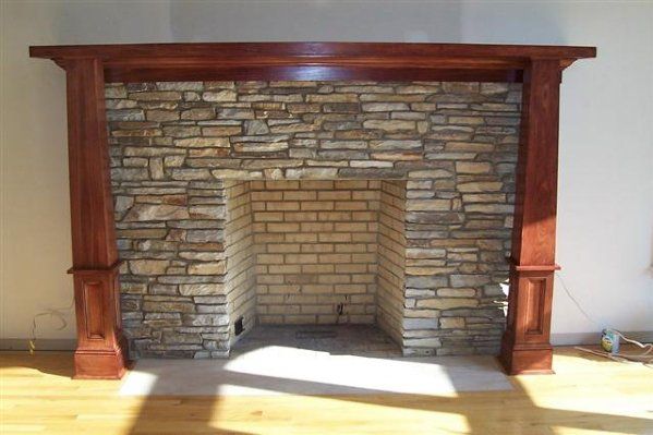 Stone fireplace with wood mantle - residential masonry in Middletown, NJ