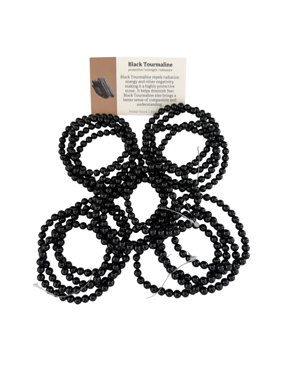 Black tourmaline beaded bracelets with a description card on a white background.