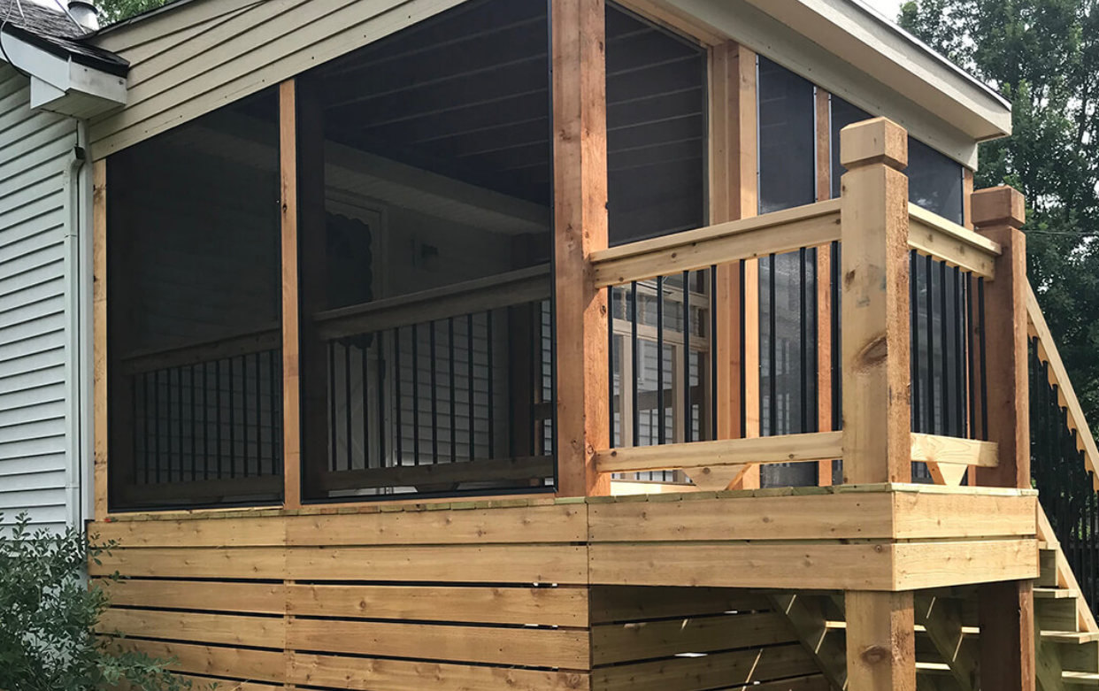 A balcony with a view of a body of water
