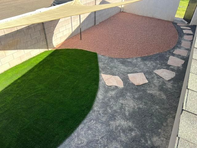 An aerial view of a patio with a circle of grass and stepping stones.