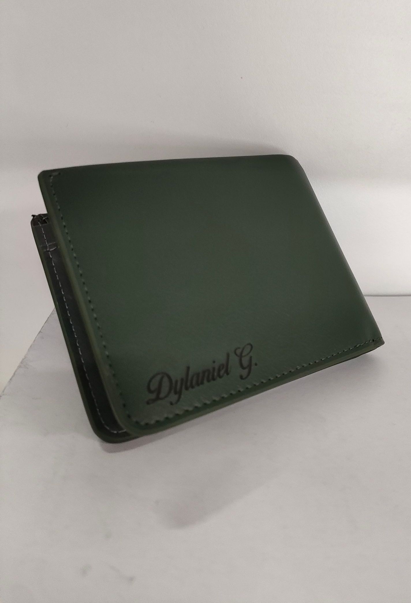 A Green Wallet With Personalised Engraving — NMTG Engraving in Wollongong, NSW