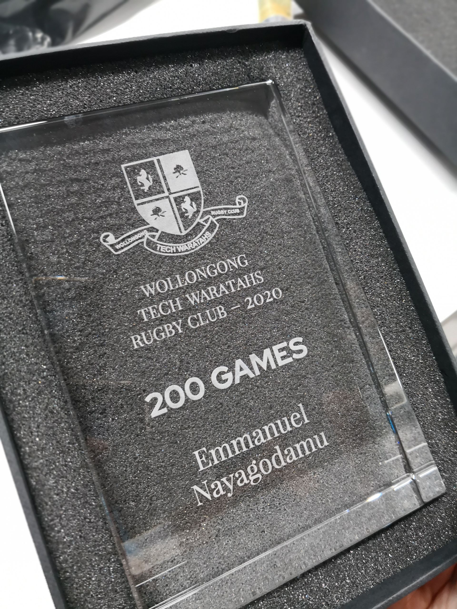 A Clear Glass Plaque With a Black Base — NMTG Engraving in Wollongong, NSW