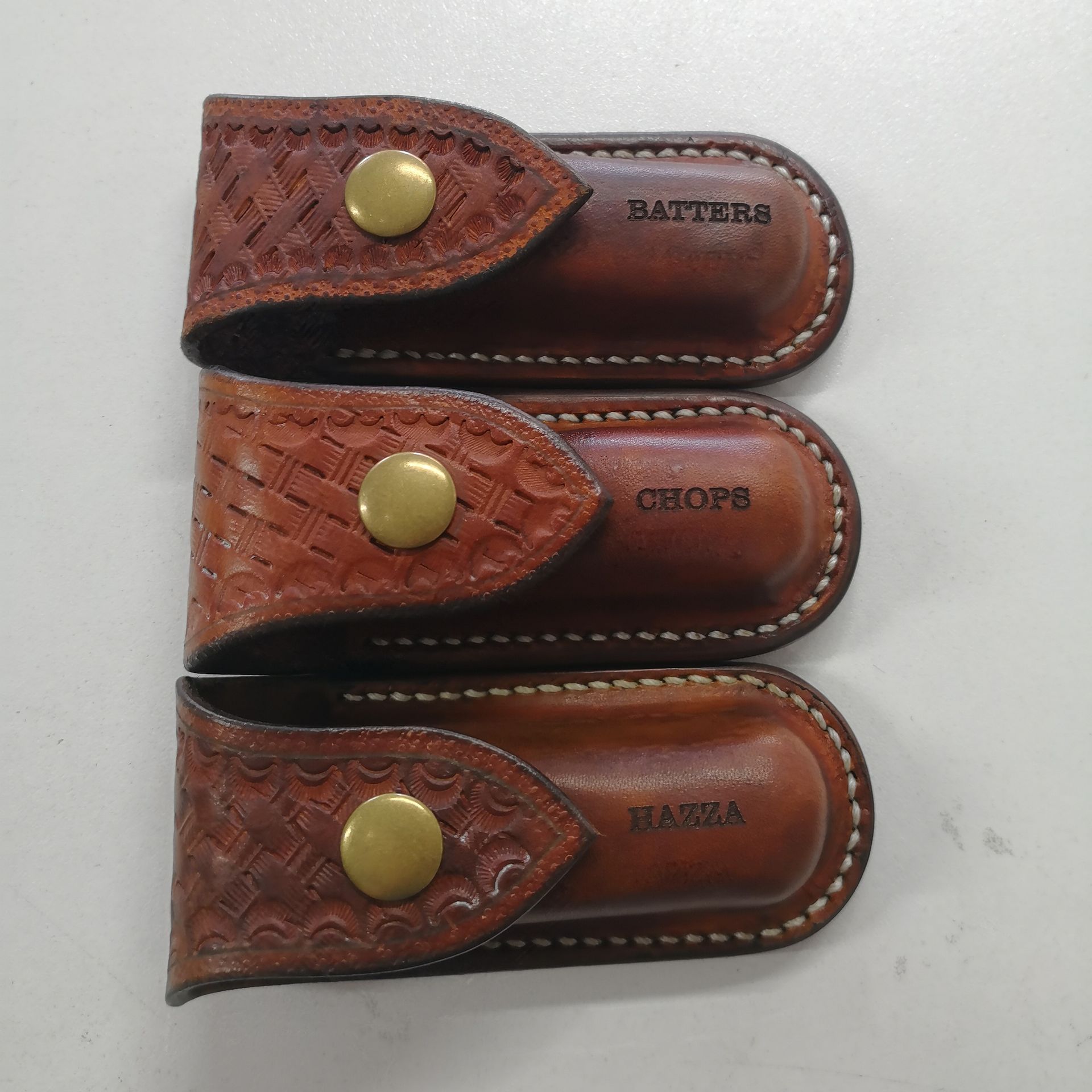 Three Brown Leather Wallets Engraved With Names — NMTG Engraving in Wollongong, NSW