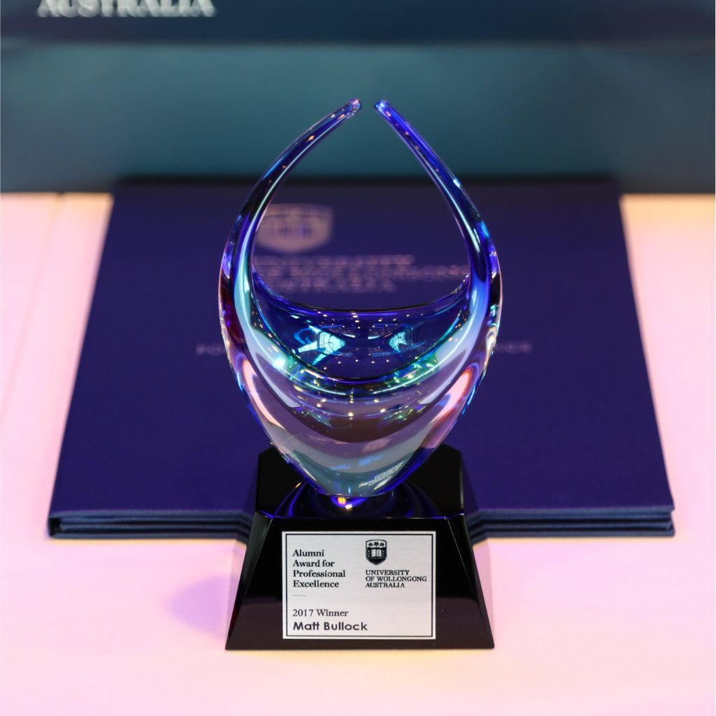 A Clear Glass Trophy With A Personalised Metal Plaque — NMTG Engraving in Shellharbour, NSW