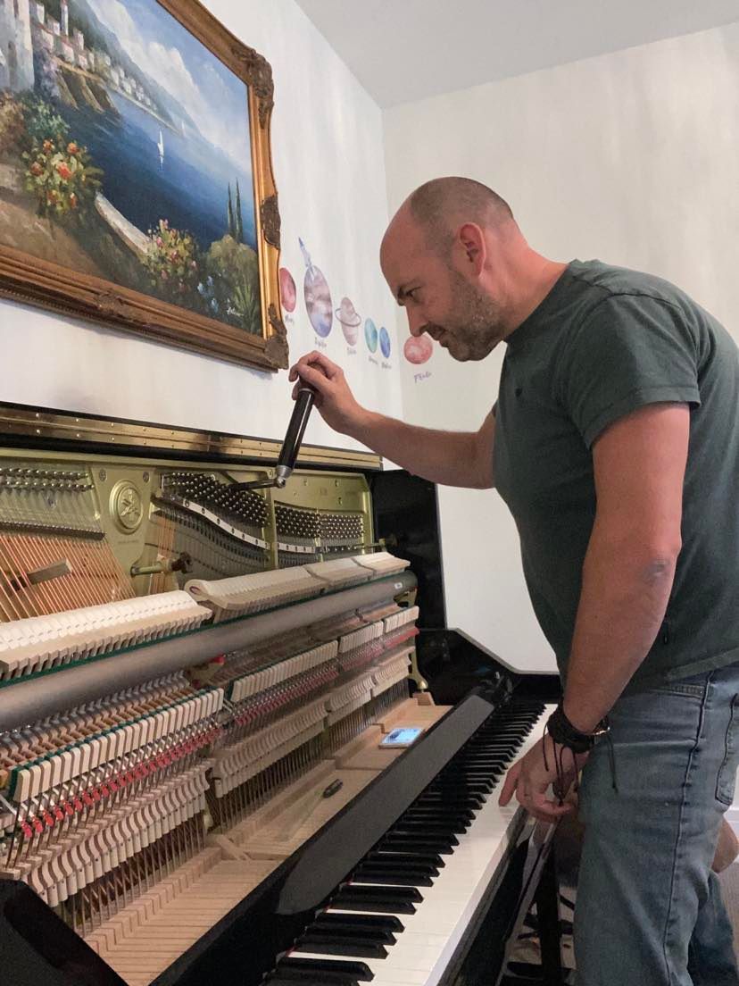 tuning a piano in Slinfold